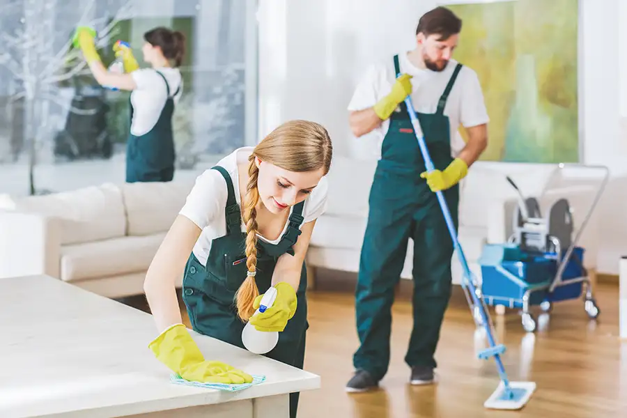 Cleaning service employees with professional equipment cleaning a private home in Springfield, IL.