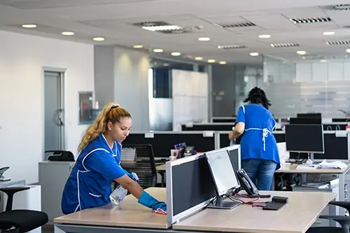Golden Rule Cleaning & More—Two professionals clean an office space in Springfield, IL.